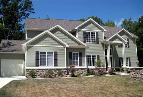 sage green house with metal roof|sage green farmhouse exterior.